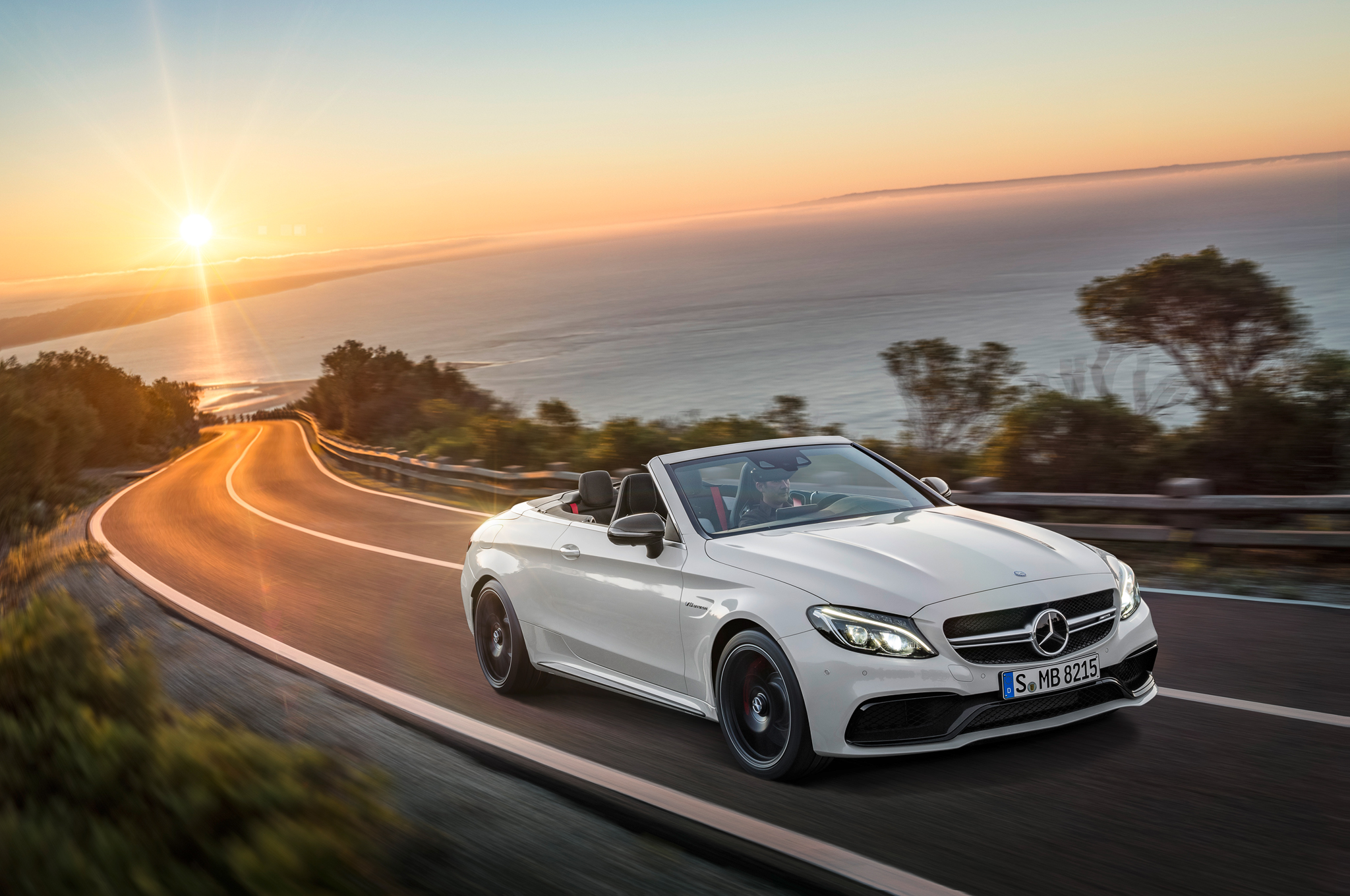 2017 Mercedes AMG C63 S Cabriolet front three quarters in motion 2017 Mercedes AMG C63 S Cabriolet front three quarters in motion