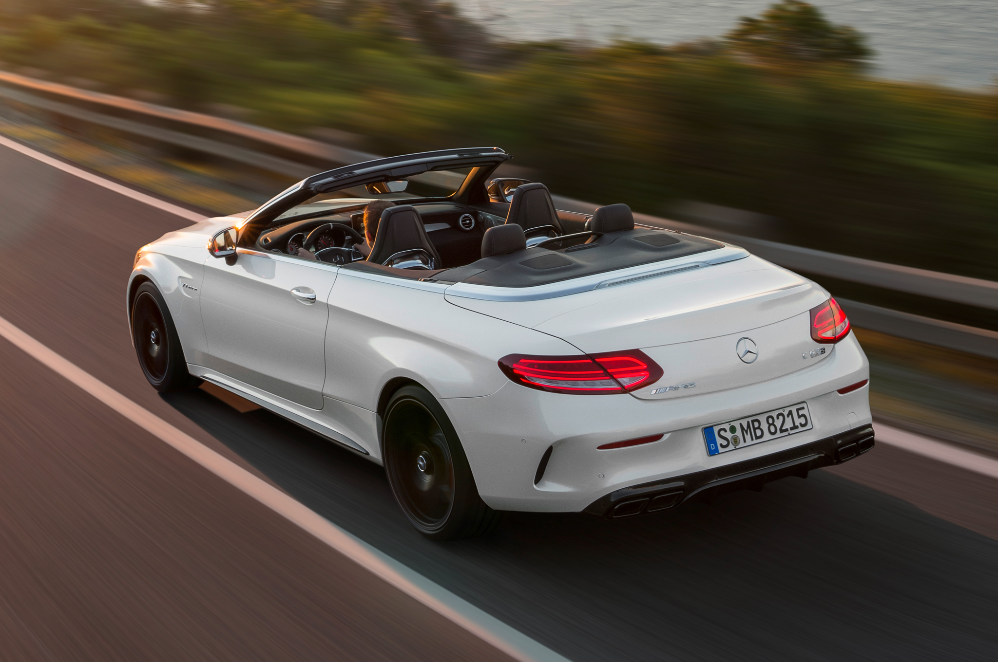 2017 Mercedes AMG C63 S Cabriolet rear three quarter in motion 2017 Mercedes AMG C63 S Cabriolet rear three quarter in motion