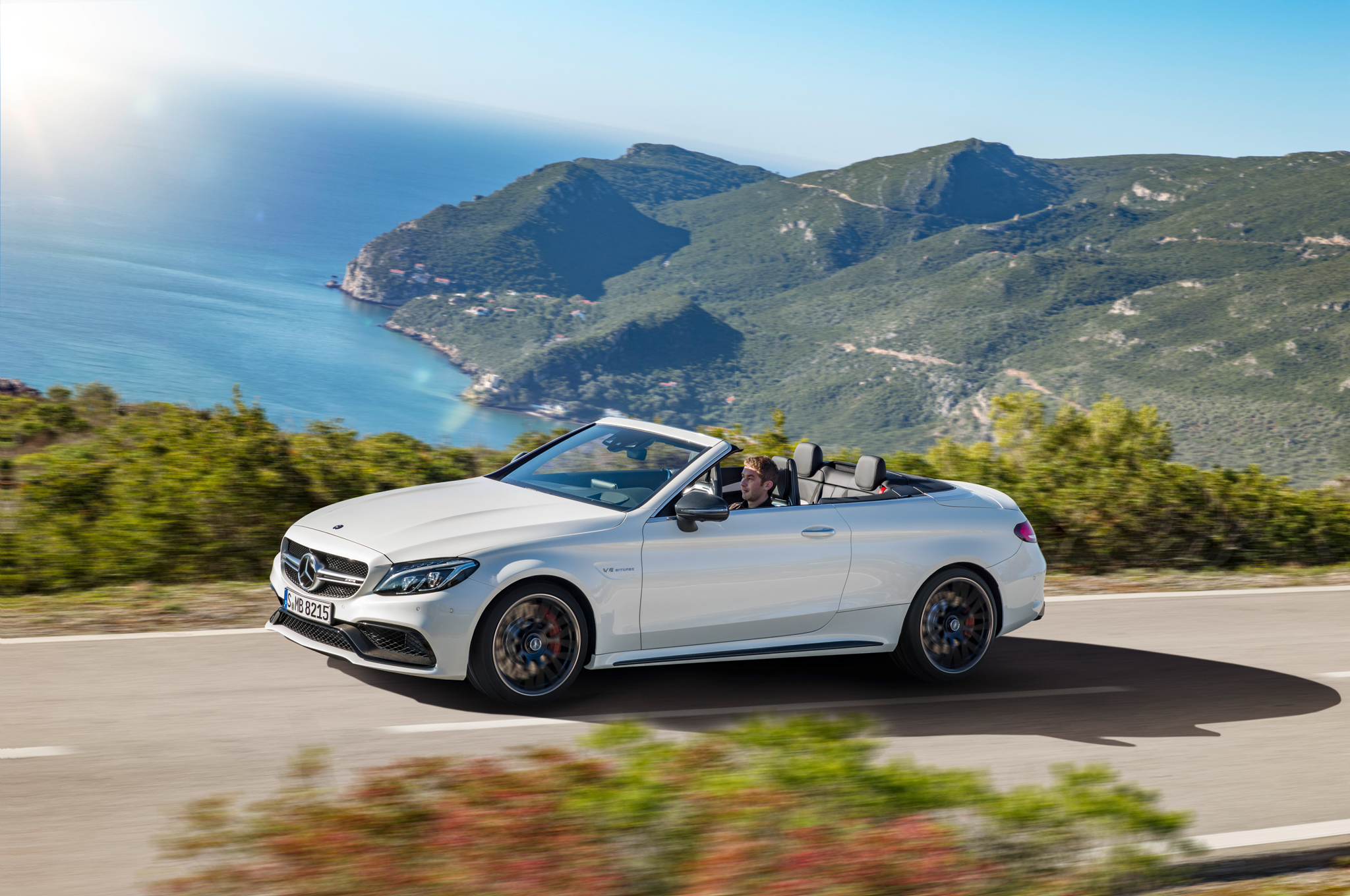 2017 Mercedes AMG C63 S Cabriolet side in motion 2017 Mercedes AMG C63 S Cabriolet side in motion