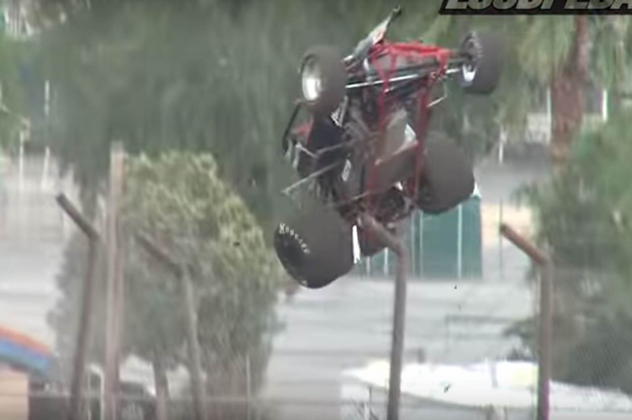 Watch a Sprint Car Flip Over a Fence and Out of the Track Automobile