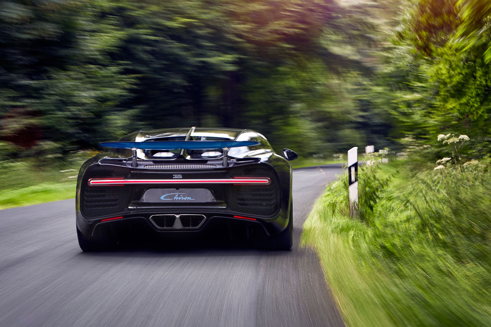 2017 Bugatti Chiron rear view in motion 2017 Bugatti Chiron rear view in motion